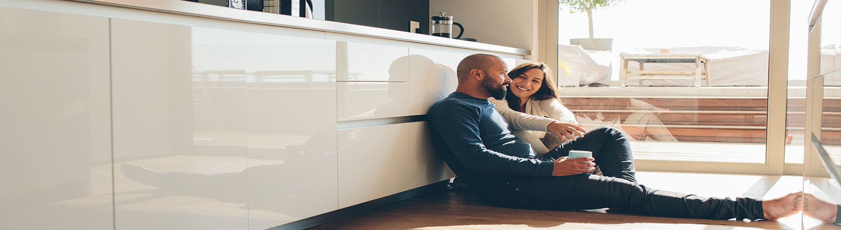 Couple on the floor in their kitchen